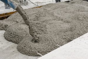 36581532 - mixed concrete pouring at construction site