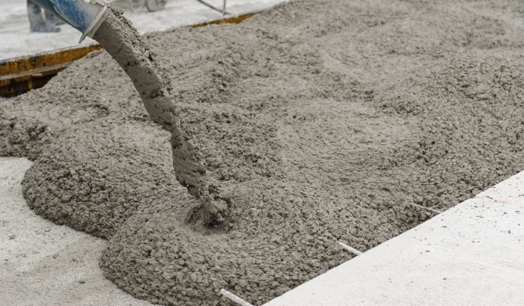 36581532 - mixed concrete pouring at construction site
